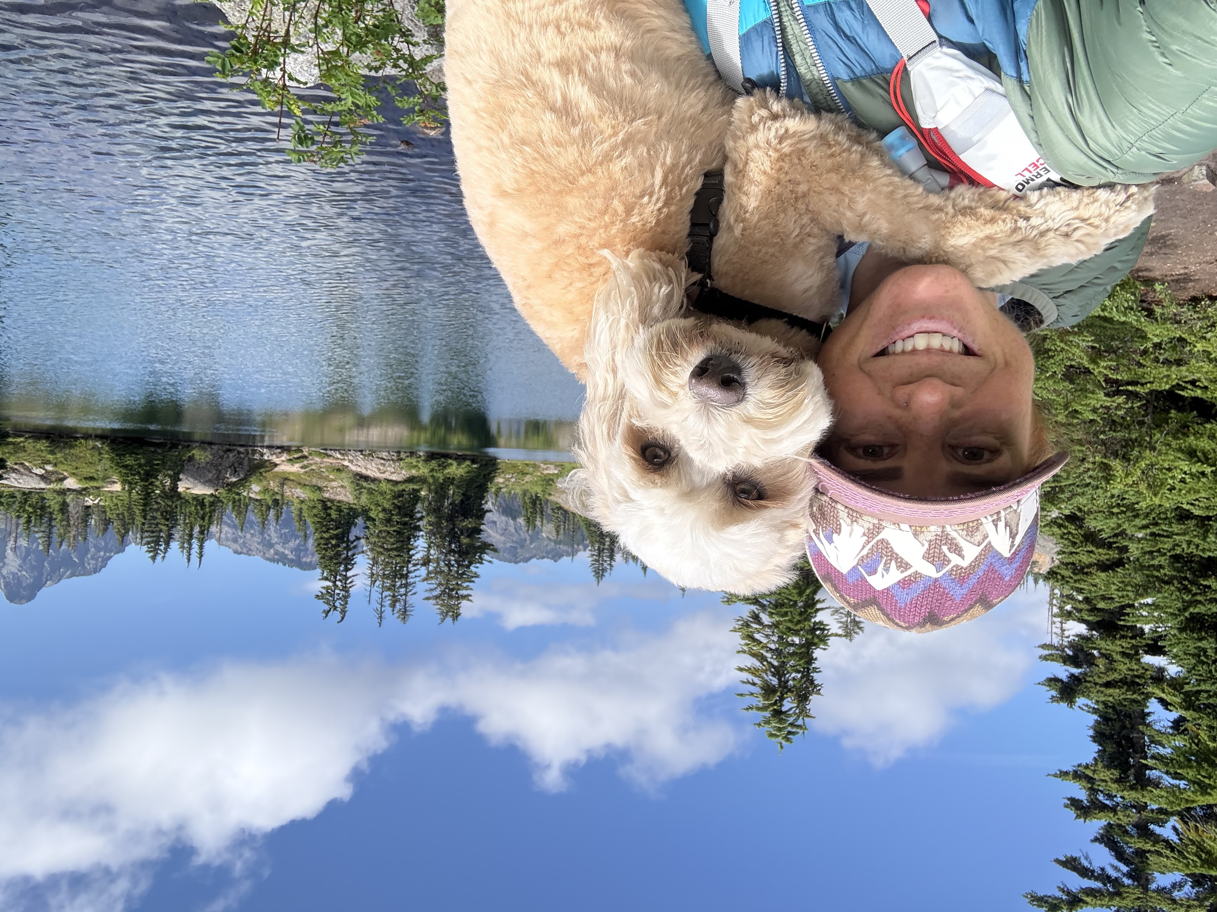 Casey hiking in the mountains with her dog